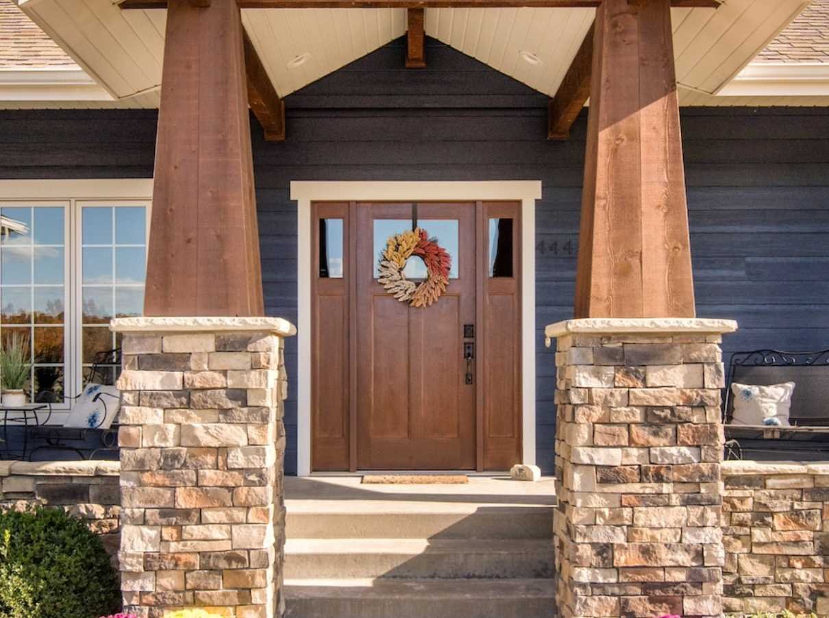 Image of the entrance to a home with a wooden door - Manhattan, KS - Fox Home Innovations